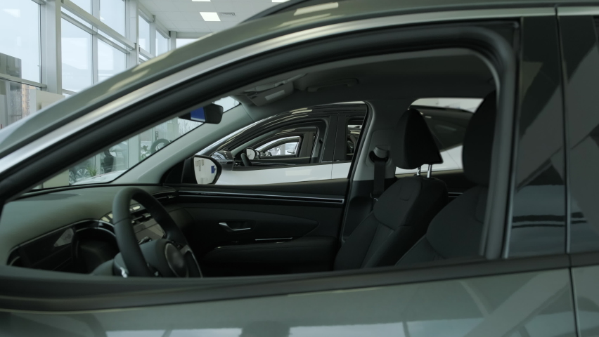 Black interior of a new car close-up. A new car is sold at a car showroom Royalty-Free Stock Footage #1084932364