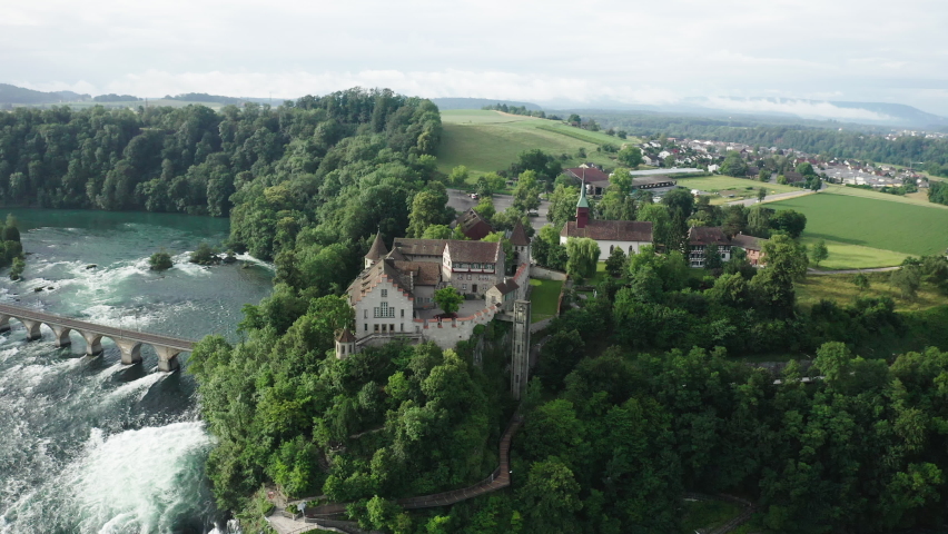 Aerial Panning Beautiful Shot Of Natural Rhine Falls In River, Drone Flying Over Houses - Schaffhausen, Switzerland Royalty-Free Stock Footage #1084936177