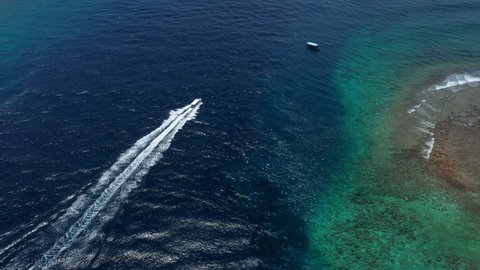 Aerial Forward Scenic Shot Of Boat Moving In Blue Sea, Drone Flying On Sunny Day - Maldives, Maldives