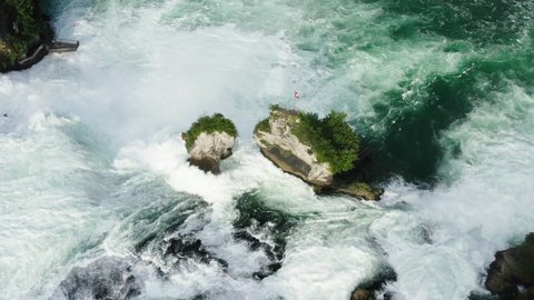 Aerial Descending Shot Of Turquoise Water Flowing In River, Drone Flying Over Rhine Falls - Schaffhausen, Switzerland