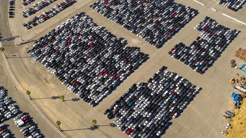 Aerial Tilt Down Over A Parking Lot Of Many Cars Crowded Into Tandem Lanes - Los Angeles, California