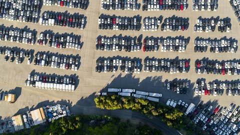 Aerial Directly Above A Parking Lot Full Of Many Cars Crowded Into Tandem Lanes - Los Angeles, California