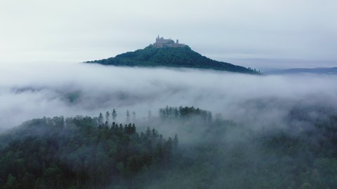 Aerial Backward Beautiful View Of Old Castle On Hilltop During Foggy Weather - Bisingen, Germany