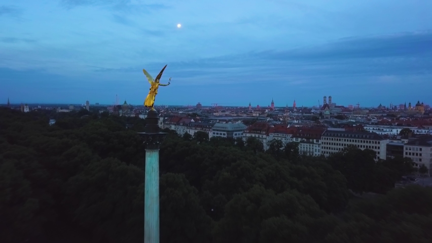 epic sunrise at angel of peace munich bavaria germany aerial flight - 4k UHD