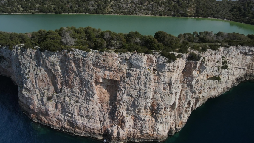 Amazing cliff agains turquoise bay, islands of National Park Kornati, Croatia