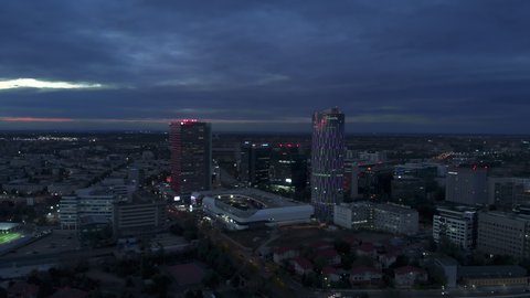 Bucharest , Romania - 12 30 2021: City skyline office buildings district aerial view at dusk Bucharest , Romania