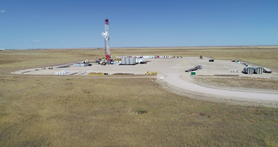Drone drop and semi orbit of a fracking operation for oil and gas 2021. 4k 60fps | Shutterstock HD Video #1084947121