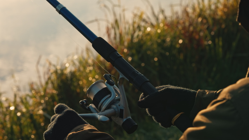 close up details hands holding fishing rod fisherman enjoy autumn outdoors leisure