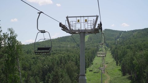 Moscow, Russia - June 1, 2021. Empty chairlift in closed ski resort due to coronavirus in summer season in mountains.