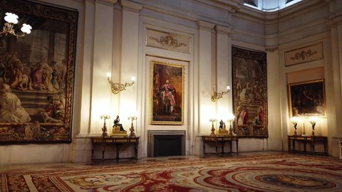 Royal Palace, Madrid, Spain - July 21 2019 : Wall-to-wall view of the Interior Hall of the Royal residence majestically decorated with with paintings and tapestries.