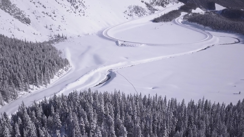 Car drives the big bend on Icefields Parkway in Banff National Park