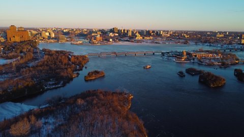 Aerial view of downtown Ottawa and Hull in Canada with the Ottawa river in early winter at sunset
