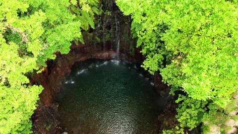Aerial 4K footage of 25 fontes falls in Madeira island. Many small waterfalls coming to a lake in a middle of jungle