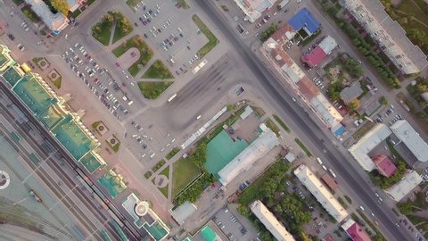 The central railway station and station Square of the city of Omsk. The building of the station. Sunset. Russia. HEAD OVER SHOT, Aerial View Hyperlapse