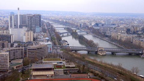 Paris, France - December 2021 : Panorama on the river Seine, the Ile aux Cygnes, Beaugrenelle district and Bir-Hakeim bridge in Paris on a winter day