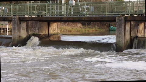 Water flowing over a weir on the river great ouse