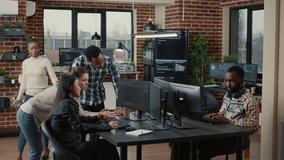 Junior dev programmers collaborating on group project compiling algorithm asking senior developer for help while intern joins the discussion. Software engineers brainstorming ideas looking at screens. - Powered by Shutterstock - Get 15% off with code: PIKWIZARD15