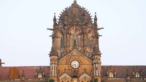 Mumbai, Maharashtra, India - 3rd Jan, 2022: Close up Real time Still video of the clock tower of Chhatrapati Shivaji Terminus (CST) Railway station building during sunset. Its an UNESCO heritage site.