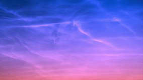 Time lapse fluroscent clouds with blue sky and pink cloudscape in horizon, fast motion mass panoramic view. UHD.