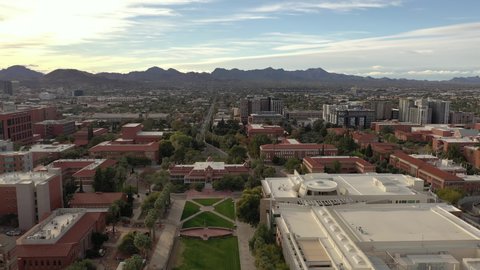 Birdseye view of Tucson University, drone tilt-down shot over old main