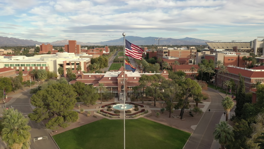 Tucson University of Arizona with American Flag on campus, drone rise