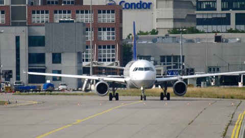 FRANKFURT AM MAIN, GERMANY - JULY 17, 2017: Plane Airbus 320 Lufthansa taxiing the taxiway at Frankfurt Airport, Germany (FRA). Tourism and travel concept.