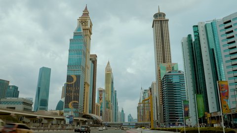 Dubai, UAE, 4 January 2022: Beautiful view of Dubai Sheikh Zayed Road with busy moving vehicle traffic on a cloudy day. 4k Video Footage.