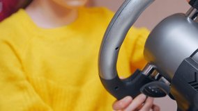 Game steering wheel close up girl hands