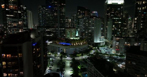 Miami, FL, USA - January 4, 2021: Night aerial video Four Seasons Hotel Miami 4k pool deck luxury