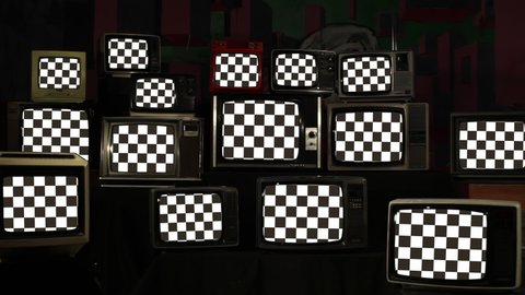 Checkered Flags on Piled Retro Televisions. 4K Resolution.