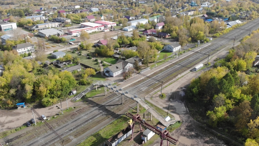 Aerial view of the railway and the village in autumn (Falenki, Kirov region, Russia)