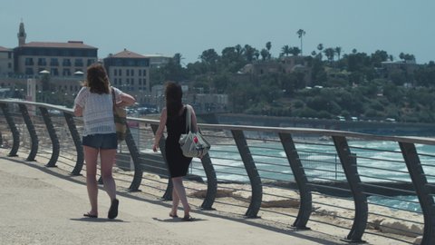 01.05.2020, Old Jaffa,Israel. Tourists walk along the Mediterranean embankment of antique Jaffa