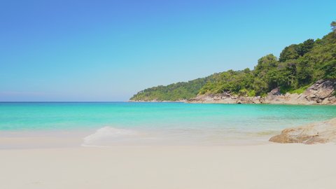 Panoramic view white sandy turquoise water tropical island. Landscape blue sea sky with clouds in sunny day. 