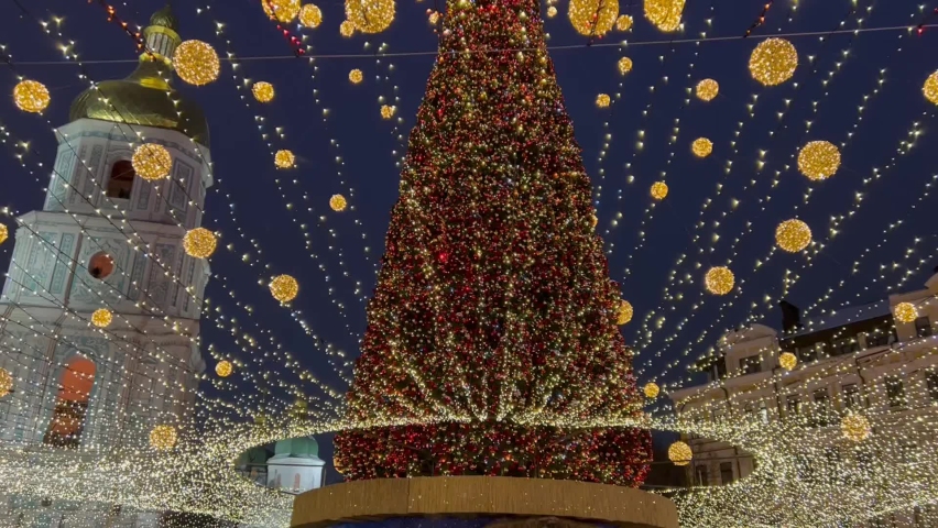 Christmas tree decorated golden illuminated balls near ancient St. Sophia