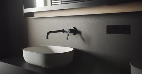 Comfortable Minimalist bathroom with black and gray tone, luxury modern home