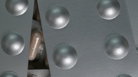 Selective focus. Capsules in blister. Blister with medicine. Tablets and pills. Close up shooting 