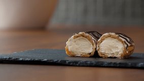 Close-up of a halved eclair with creamy filling - Powered by Shutterstock - Get 15% off with code: PIKWIZARD15