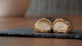 Close-up of a halved eclair with creamy filling - Powered by Shutterstock - Get 15% off with code: PIKWIZARD15