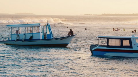 MALE, MALDIVES - OCTOBER 2021: Traditional Maldivian Dhoni boat anchored near the surf spot