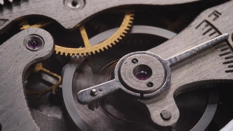 Mechanism clockwork details of watch. Cog system with gears. Inside of mechanic clock