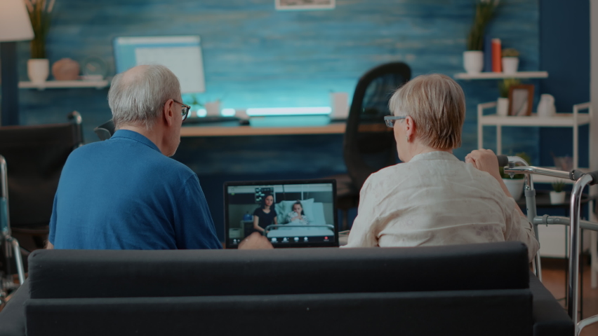 Senior people attending videocall meeting with relatives in hospital. Grandparents using laptop computer to chat with family on online remote videoconference. Internet conversation Royalty-Free Stock Footage #1085101985