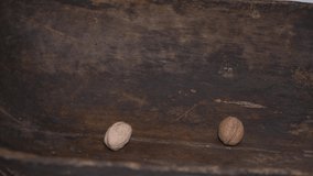 nuts poured into an old bucket. video 4 k.