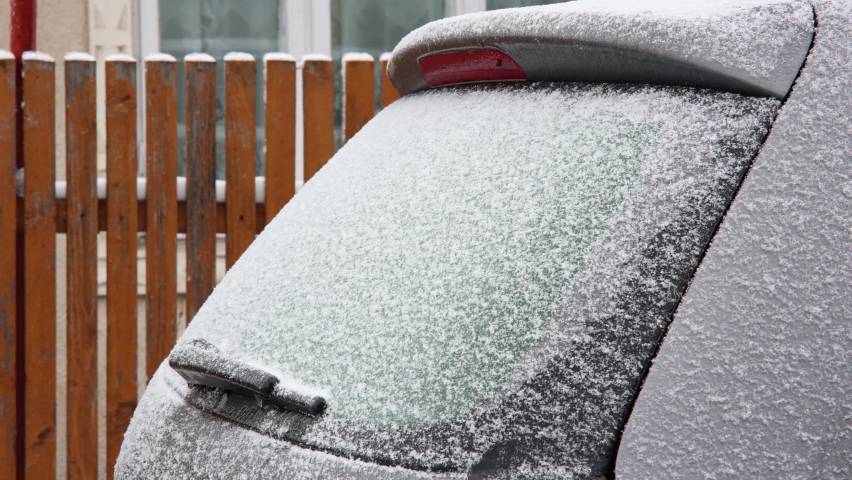 Motion Timelapse Of A Car Rear Window Frosting And Defrosting During Winter. close up