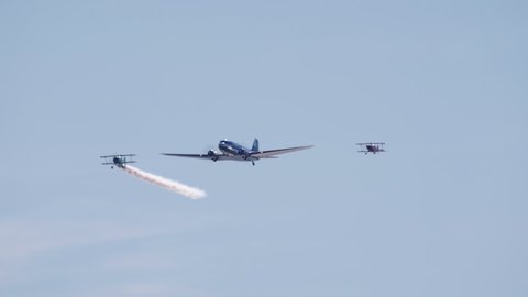 Helsinki, Finland - August 6, 2021: DC-3 and Arctic Eagles Finnish aerobatic group in Kaivopuisto Air Show