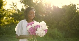 Portrait of beautiful black woman with flowers