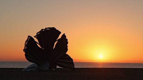 Aldeburgh, Suffolk. UK. January 3rd 2022. Time lapse of the sunrise at the Scallop sculpture on Aldeburgh Beach.