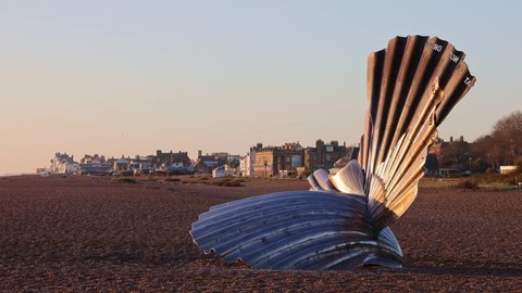 Aldeburgh, Suffolk. UK. January 6th 2022. View of Aldeburgh beach, with the Scallop sculpture in the foreground, with the town of Aldeburgh in the background.