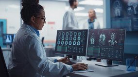 Medical Hospital Research Lab: Black Female Neuroscientist Using Computer with Brain Scan MRI Images, Finding Best Treatment for Sick Patient. Health Care Neurologist Analysing CT Scan. Arc Portrait - Powered by Shutterstock - Get 15% off with code: PIKWIZARD15