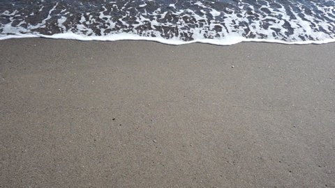 RELAXING SEA WAVES ON THE BEACH