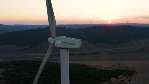 ALICANTE, SPAIN – DECEMBER 15, 2021. Wind generators of Iberdrola electricity company working in the peak of a mountain range in Spain.
